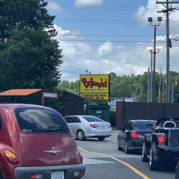 Bojangles - a red car with a surfboard on the roof - Food Near Me - Durham, North Carolina