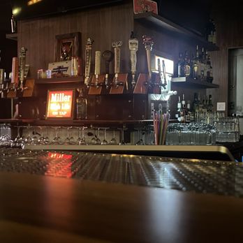 Busty's - draft beer taps, frozen drinks, and some liquor. beautiful maple bar top with some amazing plush bar seats... - Dive Bars Near Me - Austin, Texas
