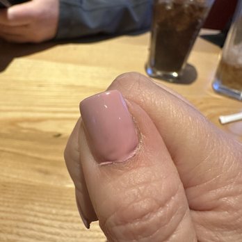 The One Nail Spa - Again with product onto the cuticle - Nail Salons Near Me - Niagara Falls, New York