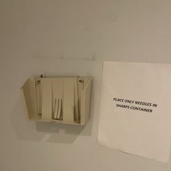 Eastern School of Acupuncture - Equipment holder hanging off the wall