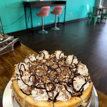 When Cheese Met Cake - a cheesecake topped with whipped cream and chocolate - Bakeries Near Me - Greenwood, Indiana When Cheese Met Cake - a cheesecake topped with whipped cream and chocolate - Bakeries Near Me - Greenwood, Indiana