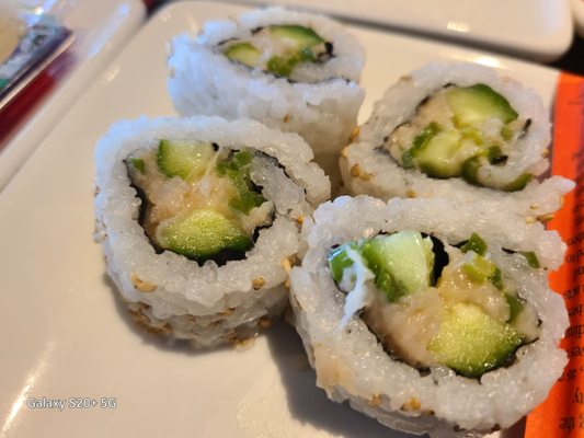 Photo of TGI Fridays - Orange, CA, US. three sushi rolls on a plate