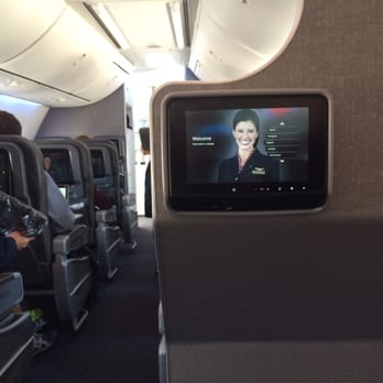 American Airlines - Nice and airy cabin and this beautiful woman staring at you makes it just right. - Airlines Near Me - Chicago, Illinois