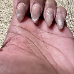 Kim’s Nails - Powder dip with cat-eye design.