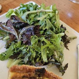 Quiche with accompanying salad.
