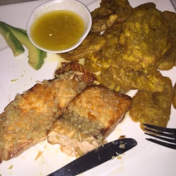 Caridad China - Garlic salmon with awesome garlic sauce and fried plantains - Latin American Near Me - Brooklyn, New York Caridad China - Garlic salmon with awesome garlic sauce and fried plantains - Latin American Near Me - Brooklyn, New York