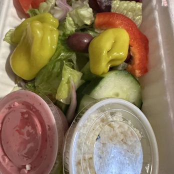 Mad Greek - Greek salad (I got the feta on the side) with the pink Greek dressing. - Greek Near Me - Romeo, Michigan Mad Greek - Greek salad (I got the feta on the side) with the pink Greek dressing. - Greek Near Me - Romeo, Michigan