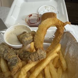 Steak strips, fries, onion ring.