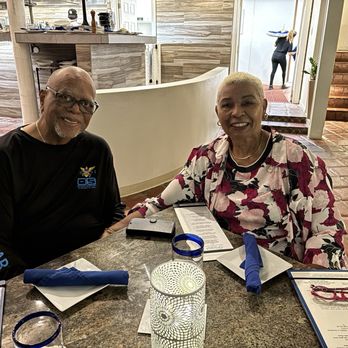Oceana Restaurant & Bistro - My husband Joe, and I at our table at Oceana Restaurant St. Thomas. - Seafood Near Me - St. Thomas, Virgin Islands Oceana Restaurant & Bistro - My husband Joe, and I at our table at Oceana Restaurant St. Thomas. - Seafood Near Me - St. Thomas, Virgin Islands