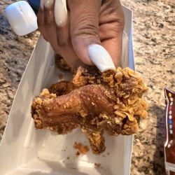 Old spicy hot wings that Estela argued were fresh.