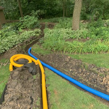 Ware Landscaping & Snow Removal - Everything drains to the back of our property, into the easement and natural drainage gradient. - Landscaping Near Me - Naperville, Illinois Ware Landscaping & Snow Removal - Everything drains to the back of our property, into the easement and natural drainage gradient. - Landscaping Near Me - Naperville, Illinois