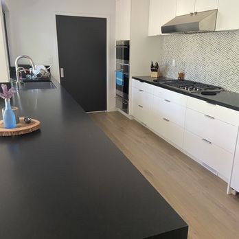 Bay Area Stone - View of kitchen peninsula, sink and stove areas with granite - General Contractors Near Me - SAN JOSE, California