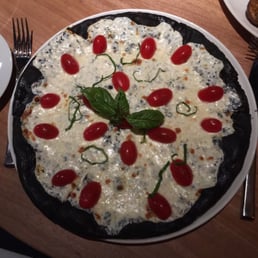 Pizza Nero - Pizza with squid ink in the dough Pizza Nero - Pizza with squid ink in the dough