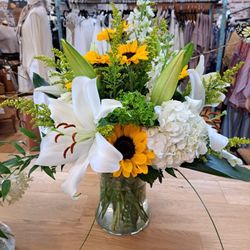 Brenda's House Of Flowers - Flower Arrangement with sunflowers and cassablanca lilies.