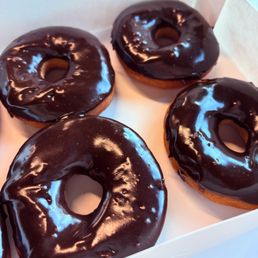 Gluten free chocolate frosted donuts.