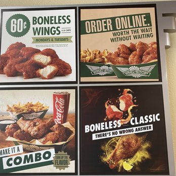 Wingstop - a variety of menus on a wall - Chicken Wings Near Me - Akron, Ohio Wingstop - a variety of menus on a wall - Chicken Wings Near Me - Akron, Ohio