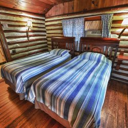 The Log Cabin Motor Court - Cabin 7 - Lazy Dazy with two twin beds, microwave, small refrigerator and coffee maker.  Air conditioned and heated.