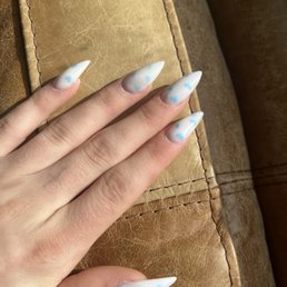 White acrylic base with blue hearts, and gem sequence nails