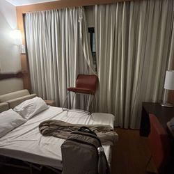 Abercrombie & Kent - My husband's makeshift solution to broken curtains at the "luxury" Novotel.