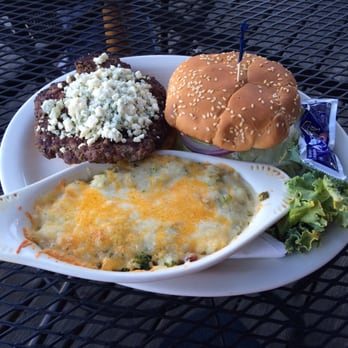 The Blue Monkey - The Blue Monkey Burger loaded with lettuce, tomatoes, pickles, mayo and lots of blue cheese for our blue cheese lovers - Bars Near Me - Memphis, Tennessee