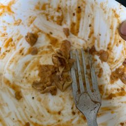 a dirty plate with a fork