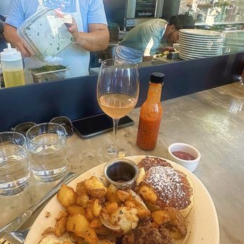 Plow - The Plow: Two Eggs, Crispy Potatoes, House Made Pork Sausage, Lemon Ricotta Pancake, house made hot sauce and grapefruit mimosa - Breakfast & Brunch Near Me - San Francisco, California