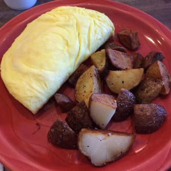 Bogart's Cafe - Crab avocado omelette with roasted potatoes. Not bad but probably wouldn't order it again. - Breakfast & Brunch Near Me - Honolulu, Hawaii