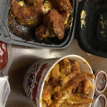 Nifty Fifty's - a bowl of fries and a container of chicken nuggies - Burgers Near Me - Philadelphia, Pennsylvania