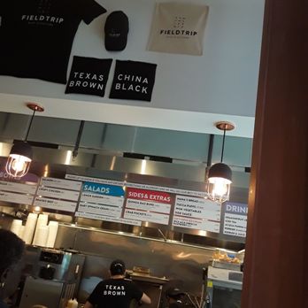 Fieldtrip Harlem - The menu is written above the work area. - New American Near Me - New York, New York