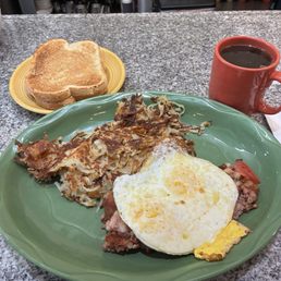 Solid and tasty: corned beef hash, eggs over hard, sourdough, and cawfee at the counter on a weekday morning. Solid and tasty: corned beef hash, eggs over hard, sourdough, and cawfee at the counter on a weekday morning.