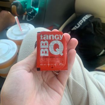 McDonald's - a hand holding a packet of coffee - Fast Food Near Me - Salida, Colorado