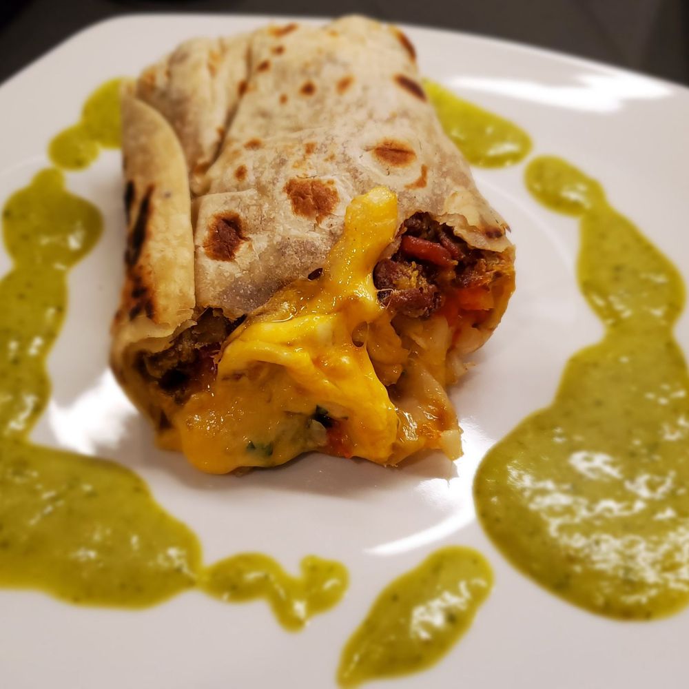 Rivas Mexican Grill - Half of a leftover bacon breakfast burrito - Mexican Near Me - Sparks, Nevada Rivas Mexican Grill - Half of a leftover bacon breakfast burrito - Mexican Near Me - Sparks, Nevada