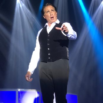 George Dyer - a man in a vest on stage - Music Venues Near Me - Branson, Missouri George Dyer - a man in a vest on stage - Music Venues Near Me - Branson, Missouri
