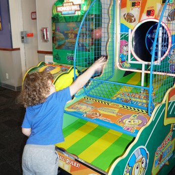 Chuck E. Cheese - a child playing a game - Pizza Near Me - Hialeah, Florida