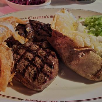 Clearman's Steak 'N Stein - Onion Rings, Rib Eye, and baked potato with block butter, sour cream, and green chives - Steakhouses Near Me - Pico Rivera, California