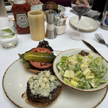 Old Ebbitt Grill - burger with blue cheese with the choice of salad, fries or something else. We chose the Caesar salad which was great - Bars Near Me - Washington, DC, District of Columbia