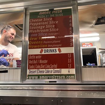 Amore Pizza - a man ordering a menu at a restaurant - Food Trucks Near Me - Denver, Colorado