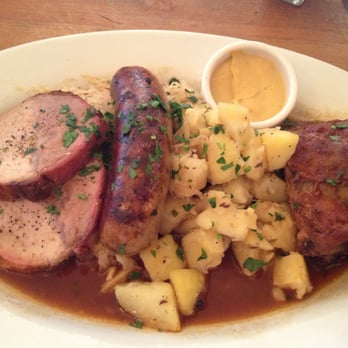 Leopold's - choucroute garni platter with pork ribs, smoked pork loin and house made bratwurst with sauerkraut - German Near Me - San Francisco, California Leopold's - choucroute garni platter with pork ribs, smoked pork loin and house made bratwurst with sauerkraut - German Near Me - San Francisco, California