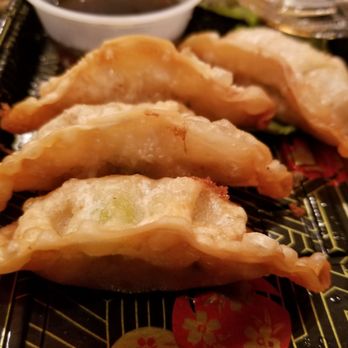 Dake Sushi - a plate of dumplings with dipping sauce - Japanese Near Me - Old Bethpage, New York