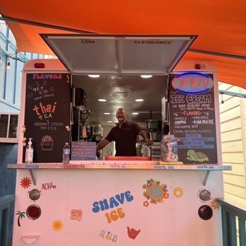 Honu Shave Ice  -  man behind a shave ice stand - Ice Cream & Frozen Yogurt Near Me - Kapaʻa, Hawaii