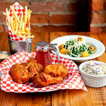 The Eagle Short North - a plate of fried chicken and a bowl of coleslaw - American Near Me - Columbus, Ohio The Eagle Short North - a plate of fried chicken and a bowl of coleslaw - American Near Me - Columbus, Ohio
