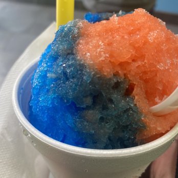 Sweet Beez - a person holding a plastic cup filled with blue and orange ice cream - Shaved Ice Near Me - Spring tx, Texas