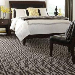 Messner Flooring - Pittsford - Bold, black, geometric patterns come alive when you add a few pops of yellow!