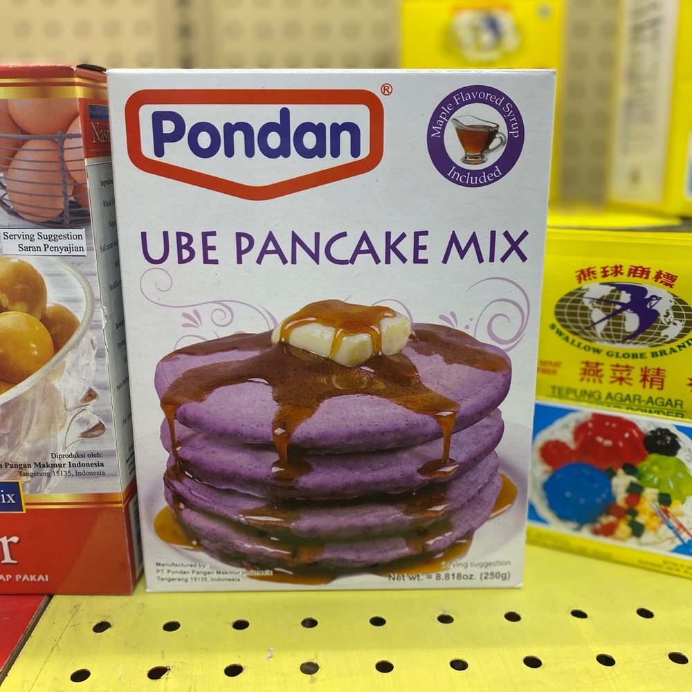 a stack of pancakes on a counter a stack of pancakes on a counter