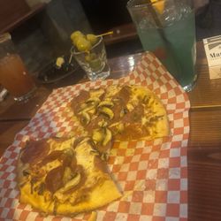 Mulligan's Spirits and Food - Delicious pizza and blue Hawaiian mixed drink