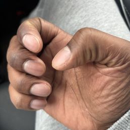 The manicure was uneven and appeared rushed, with incomplete cuticle work and little attention to detail. The manicure was uneven and appeared rushed, with incomplete cuticle work and little attention to detail.