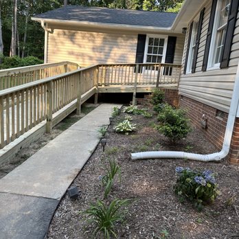 JA Cabrera Remodeling - a house with a porch and a garden - General Contractors Near Me JA Cabrera Remodeling - a house with a porch and a garden - General Contractors Near Me