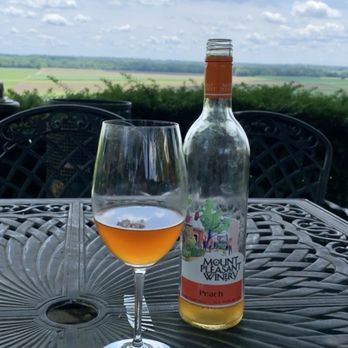 Mount Pleasant Estates - Outside patio this is the peach wine. - Wineries Near Me - Augusta, Missouri Mount Pleasant Estates - Outside patio this is the peach wine. - Wineries Near Me - Augusta, Missouri