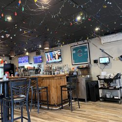 One of three dining room areas & the bar