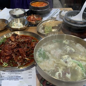 Its Tofu - Beef Intestine Soondubu (back) Spicy Raw Crab (front left) Dumpling Soup with Beef Short Rib (front right) - Korean Near Me - Irvine, California Its Tofu - Beef Intestine Soondubu (back) Spicy Raw Crab (front left) Dumpling Soup with Beef Short Rib (front right) - Korean Near Me - Irvine, California